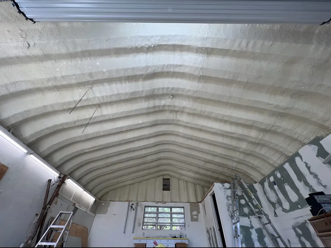 Spray polyurethane foam applied to the underside of a metal roof deck in Springfield